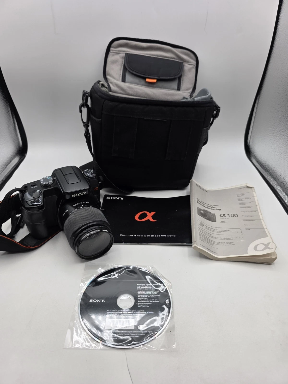 Sony Alpha A100 Digital SLR Camera With Bags and Manuals Parts Or Repair As-is